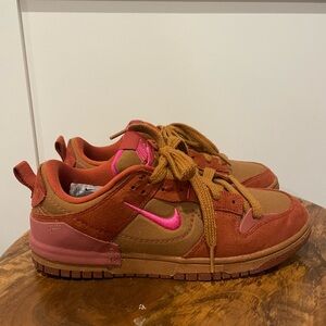Women’s pink and brown Nike Dunks